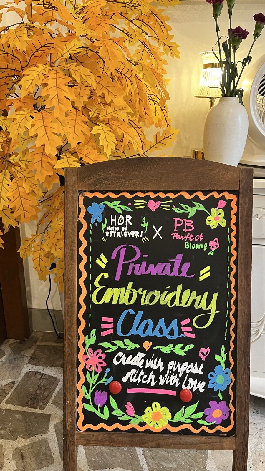 The chalkboard sign for the House of Retrievers private embroidery class